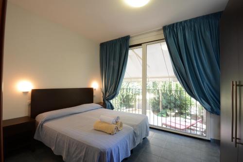 Ένα ή περισσότερα κρεβάτια σε δωμάτιο στο Graziella Residence Appartamenti