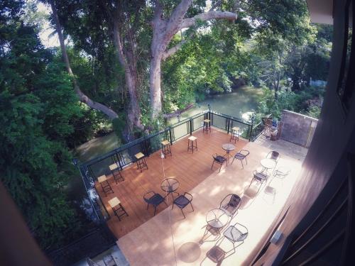 an aerial view of a deck with tables and chairs at Rimnamresidence in Ban Muak Lek