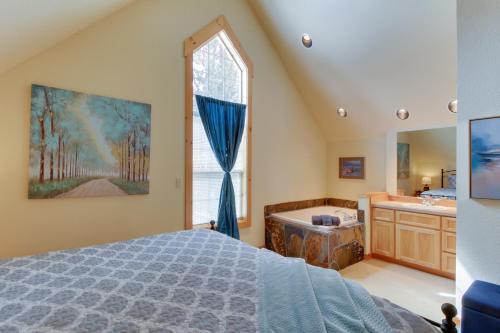 a bedroom with a bed and a tub and a window at Eagle Crest Elegance in Redmond