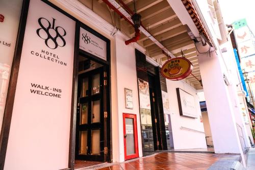 a store front of a building with a red door at Rest Chinatown Hotel in Singapore