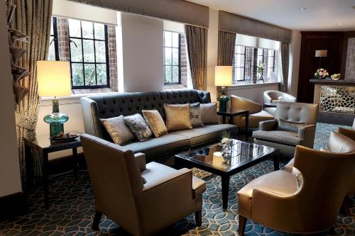 a living room with a couch and chairs at Western House Hotel At Ayr Racecourse in Ayr