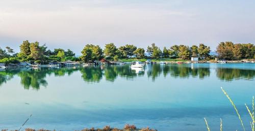 a large body of water with boats in it at Xenios Port Marina Hotel in Pefkohori