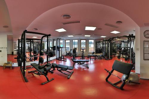 a gym with a bunch of treadms and machines at Forest Retreat&Spa in Oveselu