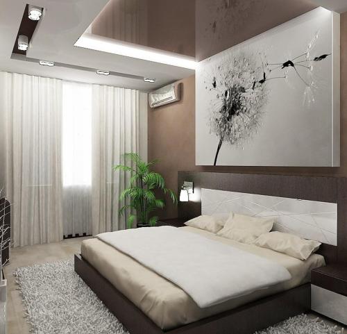 a bedroom with a large bed and a painting on the wall at Уютная 3 комнатная квартира между Дерибасовской и Аркадией in Odesa