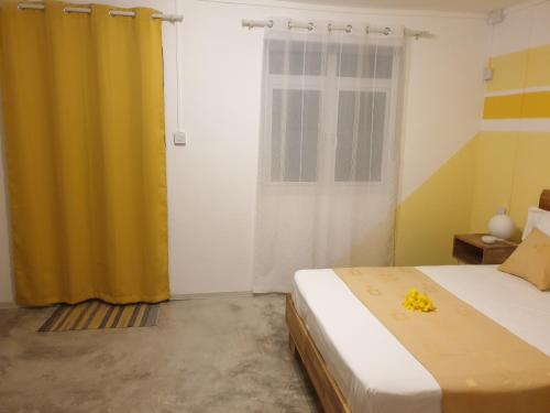 Giường trong phòng chung tại Casa Frangipani Mauritius