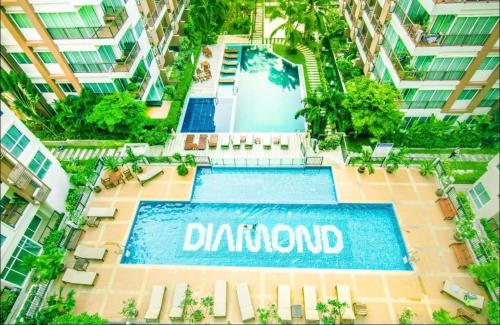 an overhead view of a swimming pool in a building at Diamond Suite in Pattaya South
