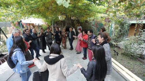 a group of people standing around in a group at Ashtarak Garden GuestHouse in Ashtarak