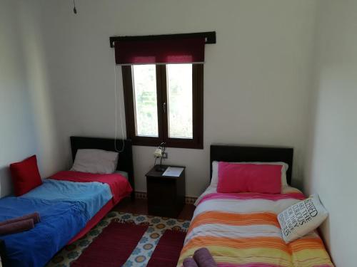 Ένα ή περισσότερα κρεβάτια σε δωμάτιο στο Habitacion en la Finca Casa Halcon