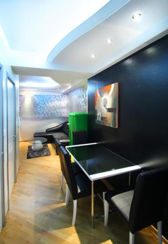 a room with a ping pong table and chairs at Apartments Belgrade in Belgrade