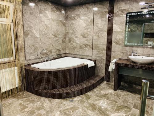 Et badeværelse på Hotel-Restaurant Complex Relax