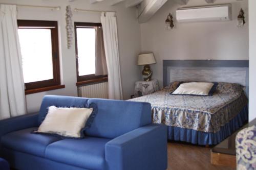 Ένα ή περισσότερα κρεβάτια σε δωμάτιο στο Le Margherite