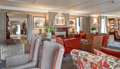 a lobby with couches and chairs in a room at Marcliffe in Aberdeen