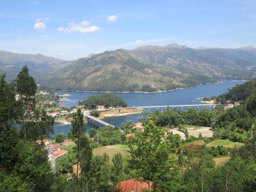 a view of a lake with mountains in the background at Casa de Casarelhos - "Gerês" - Estúdio piso 0 - Apartamento Piso 1 in Geres
