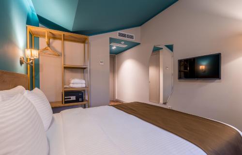 Postel nebo postele na pokoji v ubytování Gladius Inn Boutique Hotel by DNT Group