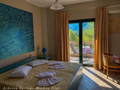 A bed or beds in a room at Acheron Springs-Markou Ilias