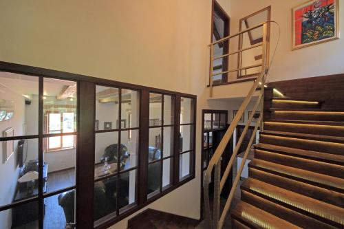 a staircase in a home with glass walls at Villa Anica Dubrovnik - luxurious with a sea view in Dubrovnik