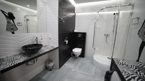 Kúpeľňa v ubytovaní Apartament Delux