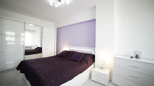 Posteľ alebo postele v izbe v ubytovaní Apartament Delux