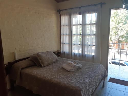 Tempat tidur dalam kamar di Remanso Apart Hotel