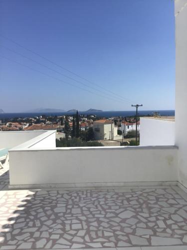 a view from the balcony of a house at SORINA Beloved Rooms in Spetses