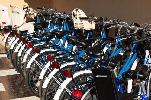 a bunch of bikes lined up in a row at Hotel Paradiso in Grottammare