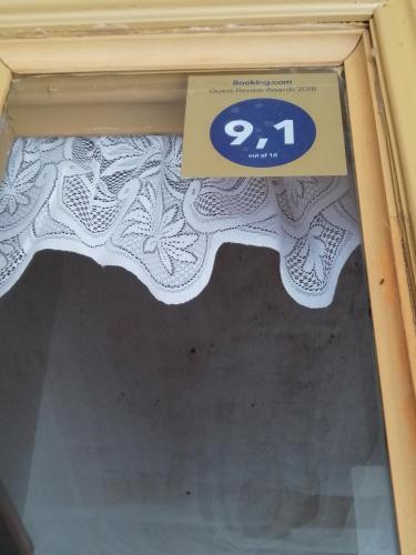 a sign on top of a window with a sign on it at Bosque Valdiviano Apartment in Valdivia