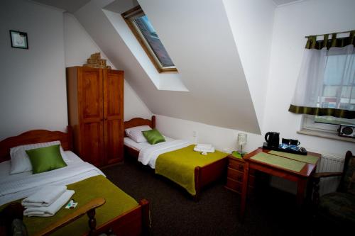 Posteľ alebo postele v izbe v ubytovaní Hotelik - Modlin Airport
