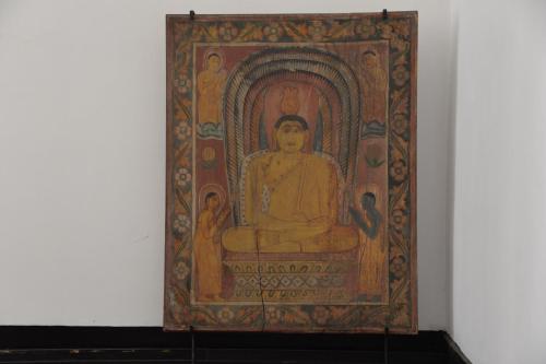 a painting of a buddha on a wall at Flower Road Villa in Colombo