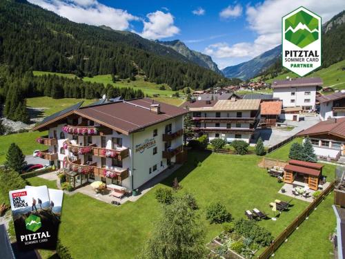 an aerial view of a hotel in the mountains at Hotel Garni Romantika in Sankt Leonhard im Pitztal