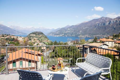 a balcony with chairs and a view of a lake at Domus Bellagio in Bellagio