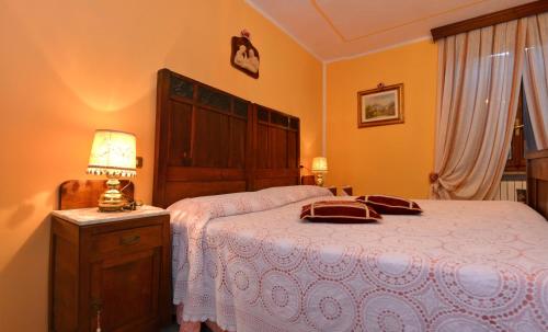Una cama o camas en una habitación de B&B Il Pavone
