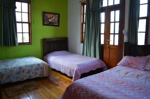 Postel nebo postele na pokoji v ubytování Hostal del Piamonte