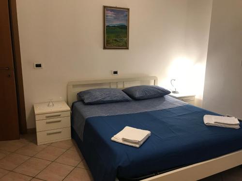 Giường trong phòng chung tại Casavacanze estate 1