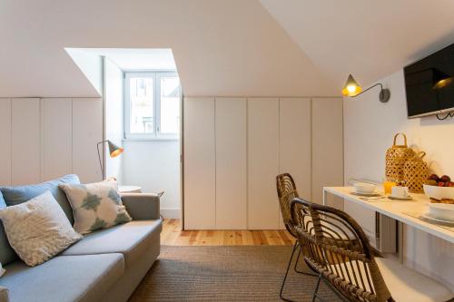 a living room with a couch and a table at Lisbon Five Stars Apartments Combro 77 in Lisbon