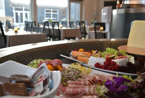 a buffet of different types of food on a table at Skærbæk Holiday Center in Skærbæk
