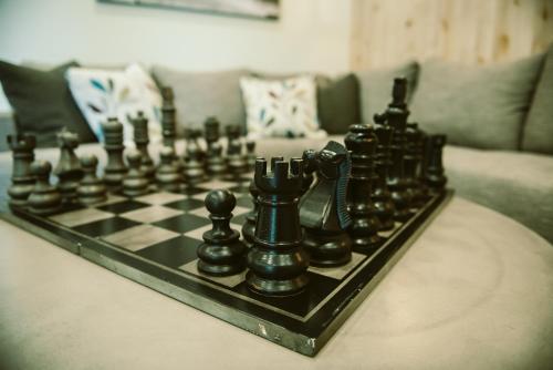 a chess board on a table in a living room at Silver Creek Hotel in Hailey