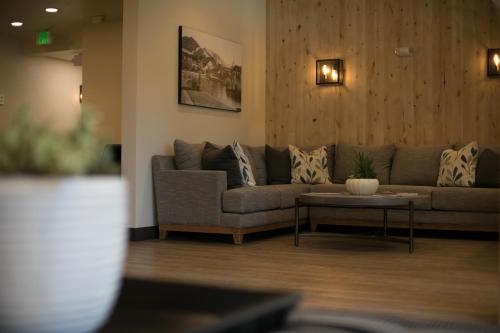 a living room with a couch and a table at Silver Creek Hotel in Hailey