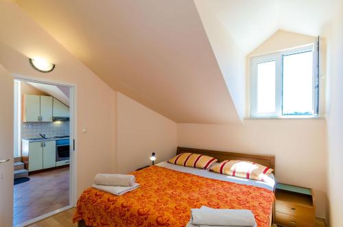 Katil atau katil-katil dalam bilik di Apartments Zanetić