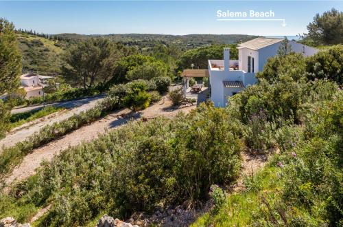 a view of the house from the hill at Salema Family Home in Salema