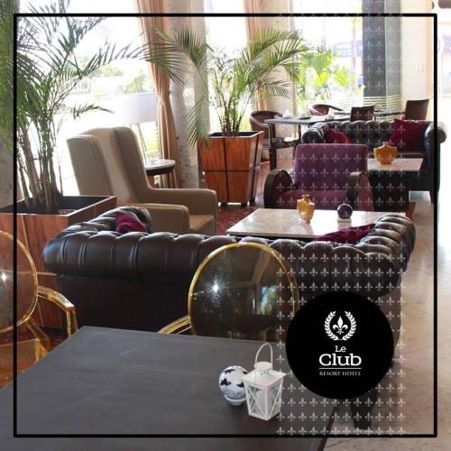 a store with couches and tables in a room at leclub resort hotel in Encarnación