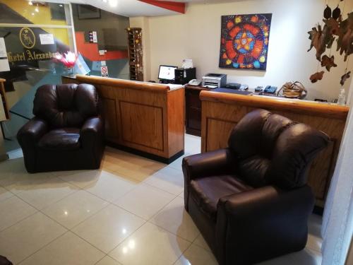 a waiting room with two chairs and a counter at Hotel Alexander in Mendoza