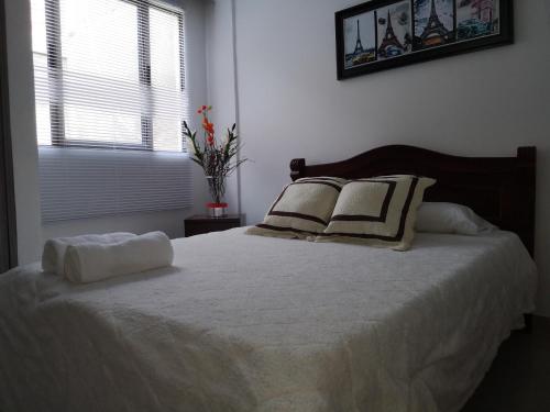 Ένα ή περισσότερα κρεβάτια σε δωμάτιο στο Aparta-Estudio 2 El Caney