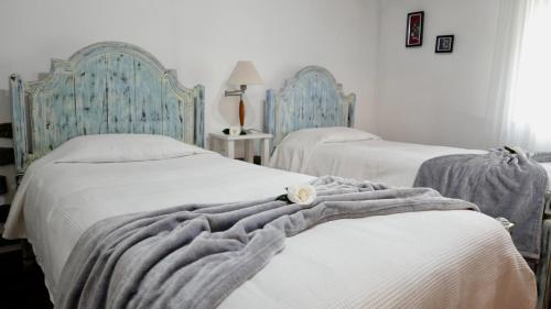 En eller flere senger på et rom på Quinta da Espadana
