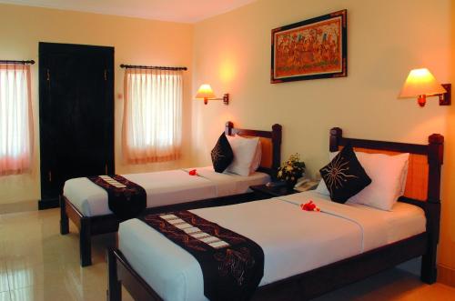 Katil atau katil-katil dalam bilik di Aneka Lovina Villas & Spa