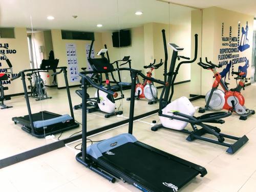 a gym with a bunch of exercise bikes at Olympus Apartments in Quito