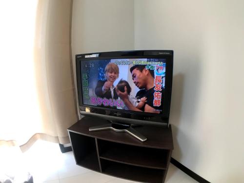 a flat screen tv sitting on top of a stand at Credo Maison Kamakura 101 in Kamakura