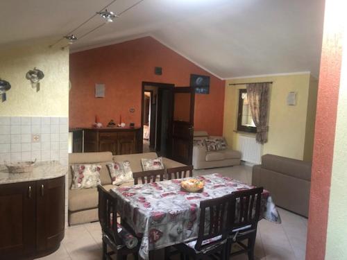 a living room with a table and a couch at Chez Bruna in Doues