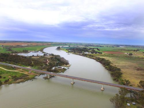 an aerial view of a river with a bridge at Old Swanport General Store, Swanport-Murray River in Swanport