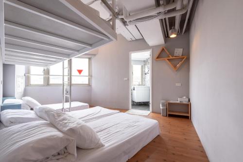 Postel nebo postele na pokoji v ubytování May Rooms Taipei Main Station