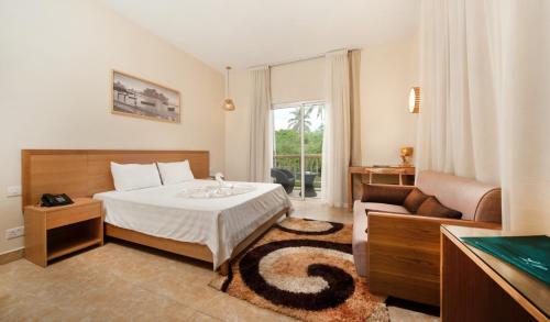 Postel nebo postele na pokoji v ubytování Le Palmiste Resort & Spa